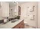 Bathroom featuring a vanity with integrated sink, medicine cabinet, and walk-in shower at 1048 N Columbine St, Golden, CO 80403