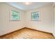 Bright bedroom with gleaming hardwood floors and two large windows for natural light at 1048 N Columbine St, Golden, CO 80403