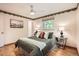 Cozy bedroom featuring a ceiling fan, soft natural lighting, and neutral decor at 1048 N Columbine St, Golden, CO 80403