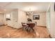 Warm dining room with wood floors, modern lighting, and tasteful wallpaper adjacent to the kitchen at 1048 N Columbine St, Golden, CO 80403