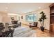 Bright living room with hardwood floors, modern rug, and a large window at 1048 N Columbine St, Golden, CO 80403