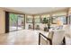 Bright sun room with tiled floors, large windows, and access to outdoor space, perfect for relaxing at 1048 N Columbine St, Golden, CO 80403