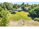 Sprawling backyard surrounded by mature trees providing plenty of room for outdoor activities and recreation at 8813 Baseline Rd, Lafayette, CO 80026
