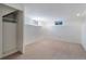 Spacious basement area featuring carpet and natural light from windows at 8813 Baseline Rd, Lafayette, CO 80026