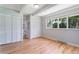 Bright bedroom featuring lots of natural light, closet space, and access to a nearby powder room or bathroom at 8813 Baseline Rd, Lafayette, CO 80026