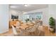 Dining room with hardwood floors and an open view to the living room at 8813 Baseline Rd, Lafayette, CO 80026