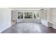 Bright living room featuring stone flooring and large bay windows at 8813 Baseline Rd, Lafayette, CO 80026