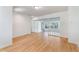 Bright living room with hardwood floors leading to a room with stone flooring at 8813 Baseline Rd, Lafayette, CO 80026