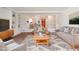Spacious living room with stone floors, gray couches and an open floor plan at 8813 Baseline Rd, Lafayette, CO 80026