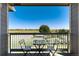 Comfortable balcony with table and chairs overlooking the adjacent open field at 804 Summer Hawk Dr # 7301, Longmont, CO 80504