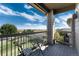Relax on the balcony with views of the community, nearby trees and clear blue sky at 804 Summer Hawk Dr # 7301, Longmont, CO 80504