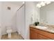 Cozy bathroom offers tile flooring, wood vanity, granite countertop, and shower at 804 Summer Hawk Dr # 7301, Longmont, CO 80504
