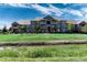 Beautiful multi-story apartment complex with well-manicured lawn and landscaping on a clear day at 804 Summer Hawk Dr # 7301, Longmont, CO 80504