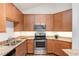 Stylish kitchen features stainless steel appliances, granite countertops, and ample cabinet space at 804 Summer Hawk Dr # 7301, Longmont, CO 80504