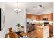Bright kitchen features stainless appliances, granite countertops, dining table, and wooden floors at 804 Summer Hawk Dr # 7301, Longmont, CO 80504