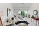Bright living room featuring a cozy fireplace, stylish furniture, and balcony access with scenic views at 804 Summer Hawk Dr # 7301, Longmont, CO 80504