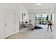 A welcoming living room with plush carpeting, a private balcony, and neutral decor at 804 Summer Hawk Dr # 7301, Longmont, CO 80504