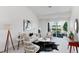 This bright living room features a fireplace, stylish furniture, and balcony access with scenic views at 804 Summer Hawk Dr # 7301, Longmont, CO 80504