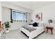 Sunlit main bedroom featuring a large window and neutral decor at 804 Summer Hawk Dr # 7301, Longmont, CO 80504