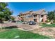 Exterior of complex featuring convenient parking, nice landscaping, and stairway access to units at 804 Summer Hawk Dr # 7301, Longmont, CO 80504