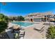 Community pool area featuring chairs, tables, and outdoor seating for residents' enjoyment at 804 Summer Hawk Dr # 7301, Longmont, CO 80504