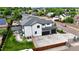 Areal showcasing the home's modern design, outdoor living space, and ample parking at 8623 S Wadsworth Ct, Littleton, CO 80128