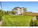 Expansive backyard featuring lush green lawn, a patio, and privacy fencing at 8623 S Wadsworth Ct, Littleton, CO 80128