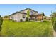 Well-maintained backyard showcasing a spacious lawn and covered patio area at 8623 S Wadsworth Ct, Littleton, CO 80128