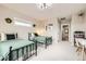 Bright bedroom featuring two twin beds, neutral walls, and ample natural light at 8623 S Wadsworth Ct, Littleton, CO 80128