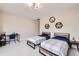 Cozy bedroom with stylish decor, neutral paint, and comfortable furnishings at 8623 S Wadsworth Ct, Littleton, CO 80128