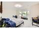 Bright bedroom with large bay windows, carpet floors and abundant natural light at 8623 S Wadsworth Ct, Littleton, CO 80128