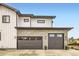 Stylish two-car garage with stone accents and modern doors enhances curb appeal at 8623 S Wadsworth Ct, Littleton, CO 80128