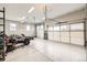 Spacious garage with epoxy flooring and multiple overhead doors at 8623 S Wadsworth Ct, Littleton, CO 80128