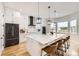 Modern kitchen features a large island, stainless steel appliances, and bright natural light at 8623 S Wadsworth Ct, Littleton, CO 80128