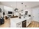 Spacious kitchen with an island, modern appliances, and open layout to living areas at 8623 S Wadsworth Ct, Littleton, CO 80128