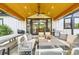 Covered outdoor patio featuring a comfortable seating area and outdoor kitchen at 8623 S Wadsworth Ct, Littleton, CO 80128
