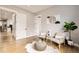 Bright sitting room featuring hardwood floors, contemporary decor, and neutral paint for a calm and relaxing space at 8623 S Wadsworth Ct, Littleton, CO 80128
