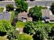 Aerial view showcasing the home's layout, landscaping, and outdoor patio in a private backyard at 7019 S Windermere St, Littleton, CO 80120