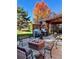 Relaxing outdoor patio with fire pit, grill, and seating area, perfect for entertaining at 7019 S Windermere St, Littleton, CO 80120