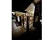 Private patio area with brick features, wrought iron gate, and landscaped surroundings at 7019 S Windermere St, Littleton, CO 80120