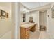 Clean bathroom vanity with plants and modern lighting at 7019 S Windermere St, Littleton, CO 80120