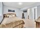 Well lit bedroom with carpet, a large bed, and a closet at 7019 S Windermere St, Littleton, CO 80120