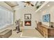 Bonus room featuring a fireplace, wood accents, an exercise bike, and views at 7019 S Windermere St, Littleton, CO 80120