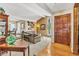 Inviting living room with beamed ceilings, hardwood floors, large windows, and elegant furnishings at 7019 S Windermere St, Littleton, CO 80120