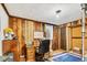 Cozy office space with wood paneled walls and a work desk at 7019 S Windermere St, Littleton, CO 80120