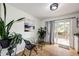 Charming dining area with glass table, black chairs, and access to deck at 6142 Van Gordon St, Arvada, CO 80004