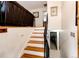 Wooden staircase leading to the upper level with a view of the basement at 6142 Van Gordon St, Arvada, CO 80004