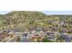 Aerial view of a community showcasing well-maintained homes, green spaces, and scenic mountain backdrop at 3995 Manorbrier Cir, Castle Rock, CO 80104