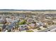 Scenic aerial view of a vibrant community with well-maintained homes, lush landscaping, and mountain backdrop at 3995 Manorbrier Cir, Castle Rock, CO 80104