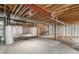Unfinished basement featuring concrete floors and exposed ceilings ready for customization and storage at 3995 Manorbrier Cir, Castle Rock, CO 80104